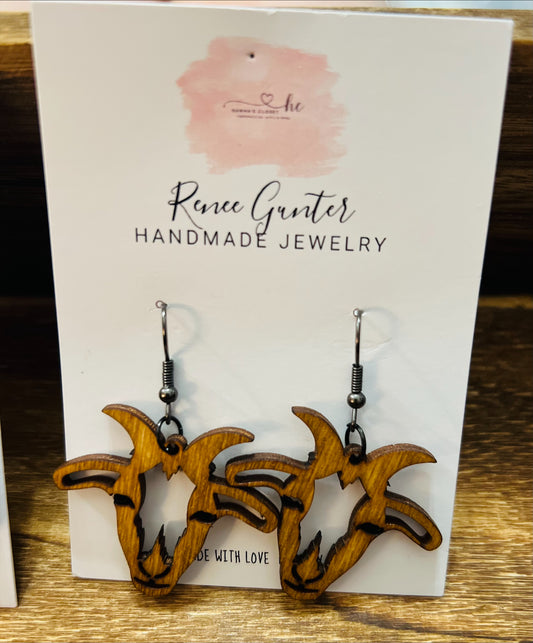 Handmade wood goat earrings.