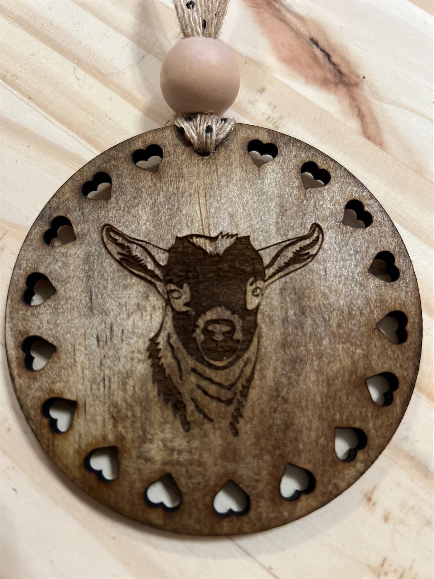 Round wood goat ornament