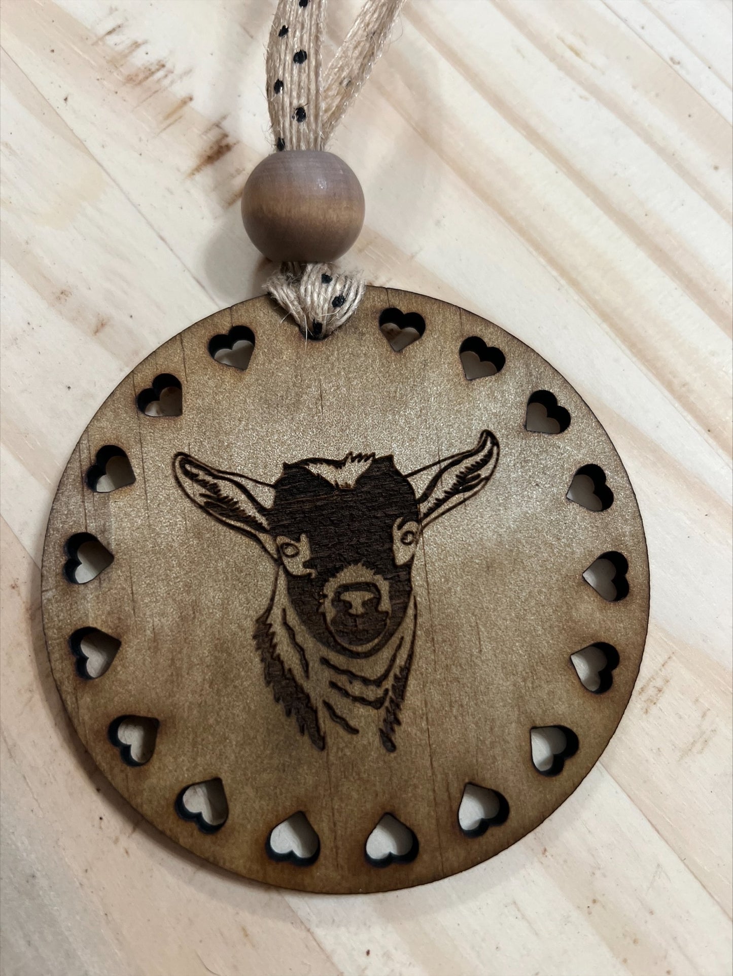 Round wood goat ornament