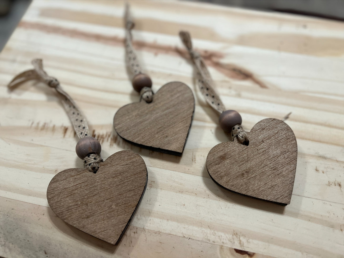 Handmade set of three bass wood double layered heart ornaments