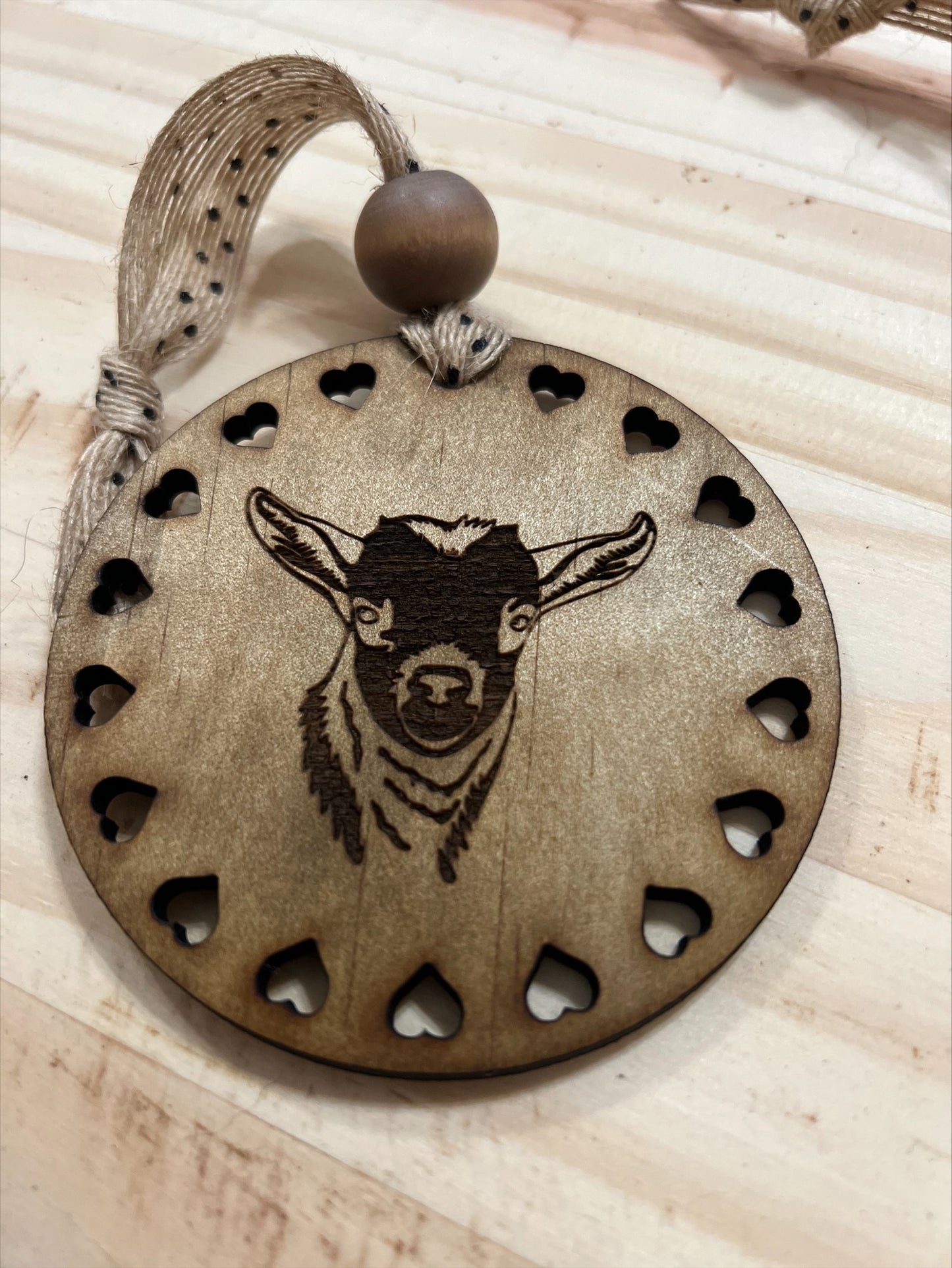 Round wood goat ornament