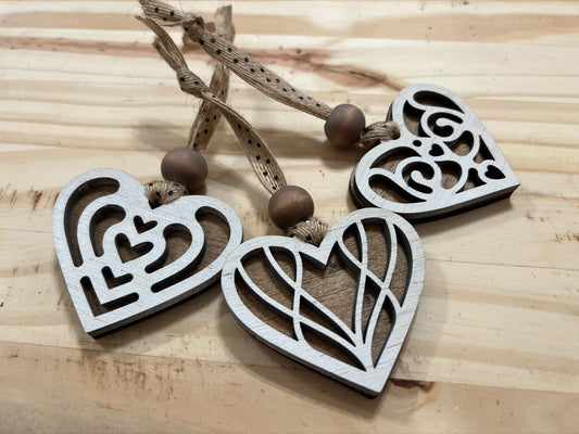 Handmade set of three bass wood double layered heart ornaments